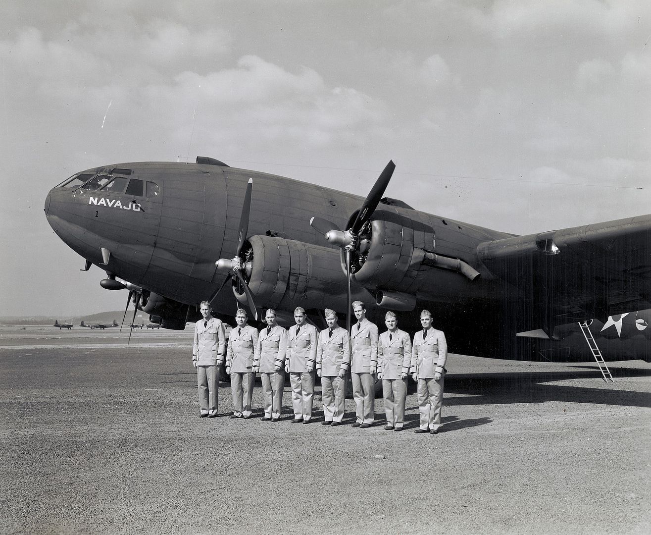 https://oi262.photobucket.com/albums/ii120/Duggy009/Boeing%20307/Boeing%20C-75%20Stratoliner%20Navajo%20on%20the%20ground%20eight%20unidentified%20TWA%20crewmen%20in%20uniform%20pose%20standing%20in%20a%20line%20in%20front%20location%20unknown..jpg